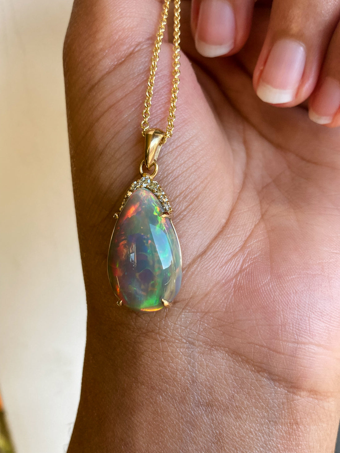 14k solid yellow gold black opal  teardrop pendant with diamond accents