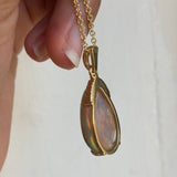 Back side view of black opal and diamond necklace