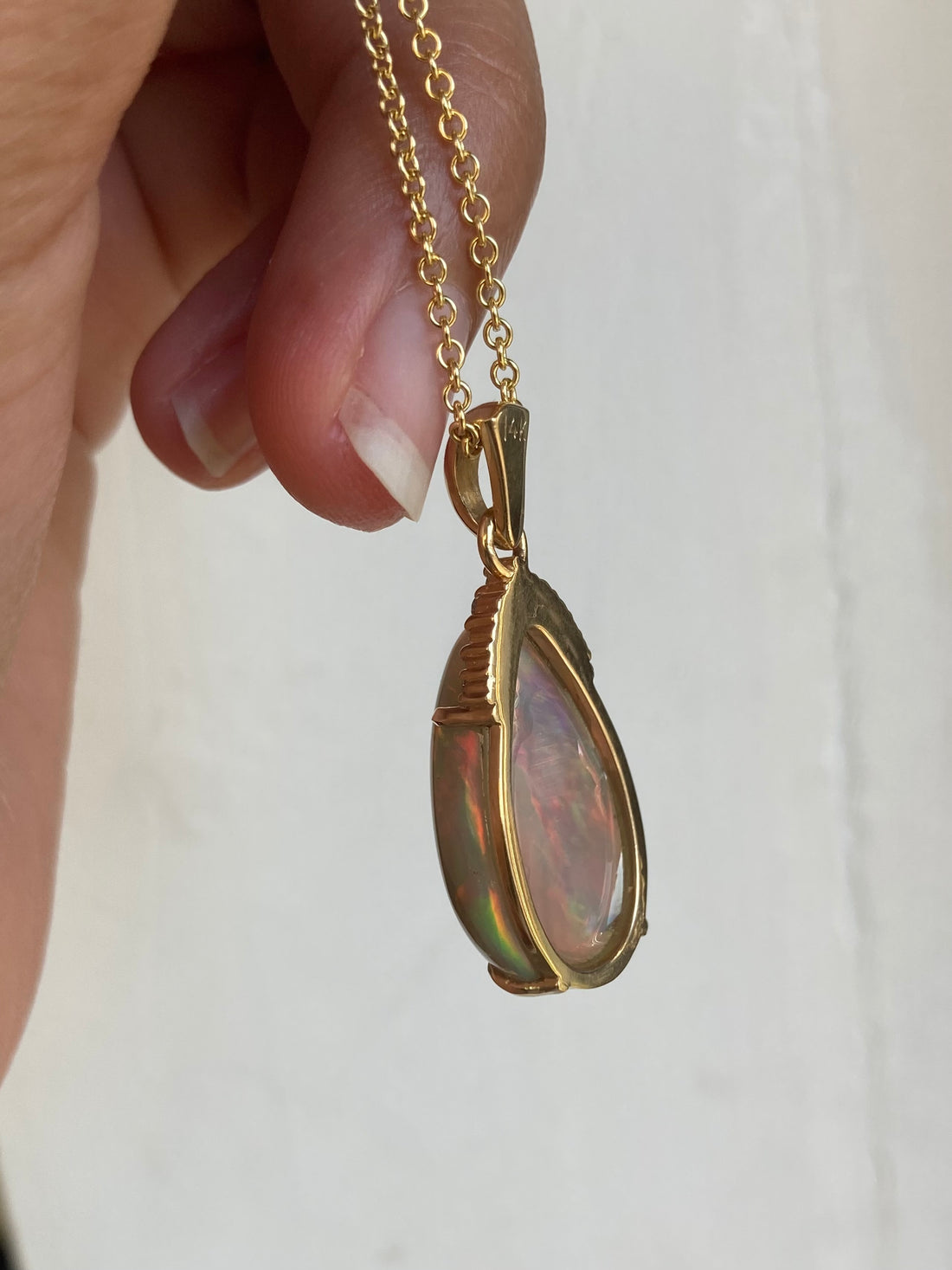 Back side view of black opal and diamond necklace