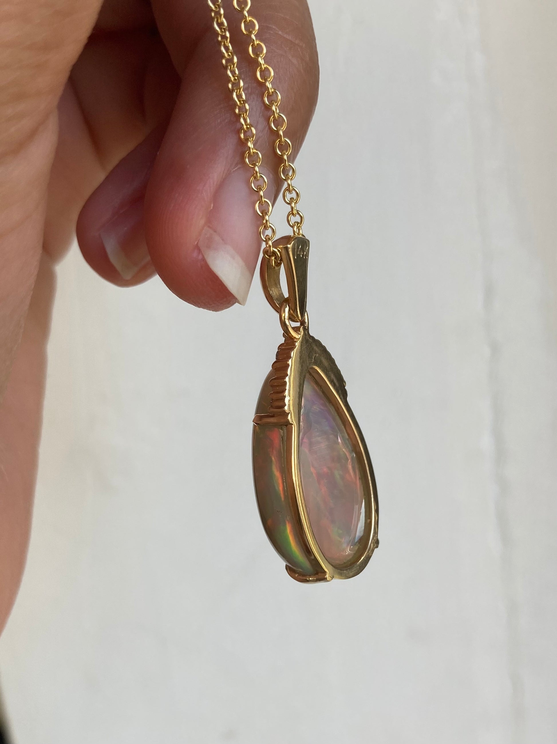 Back side view of black opal and diamond necklace