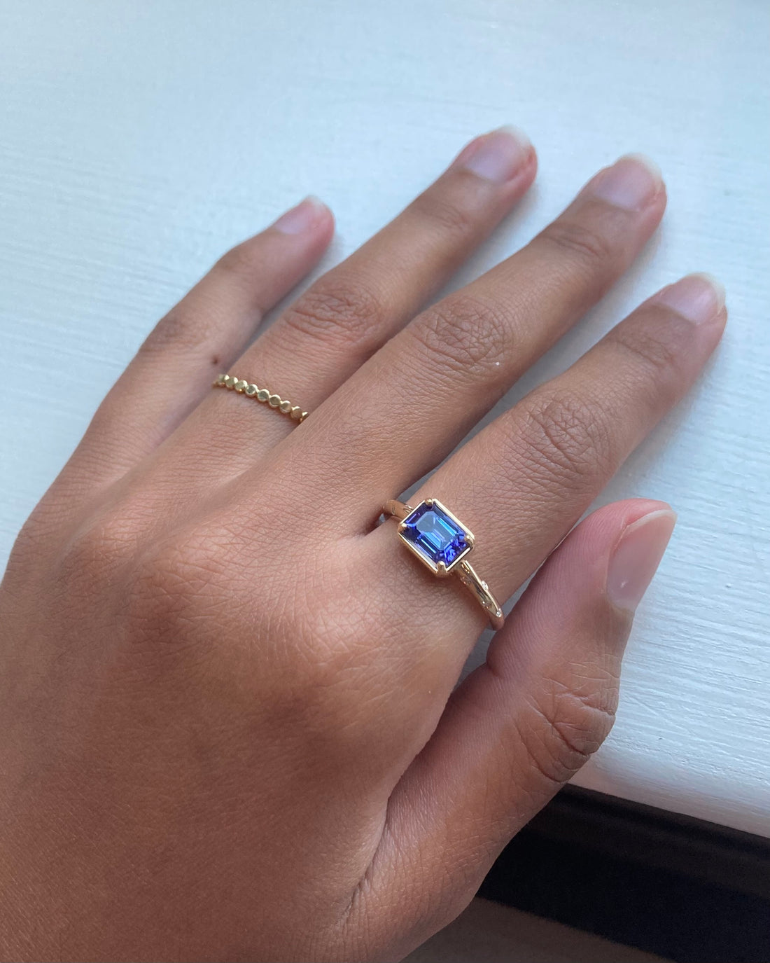 14k Tanzanite Ring with a Diamond Dotted Band - Emerald Cut