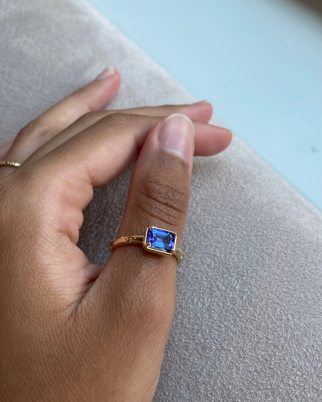 14k Tanzanite Ring with a Diamond Dotted Band - Emerald Cut
