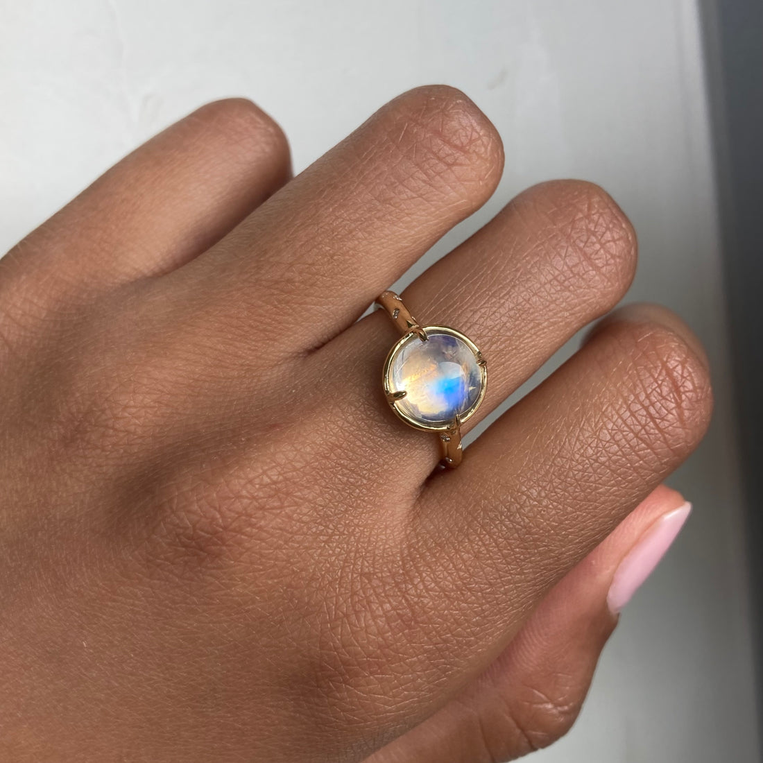 14k Moonstone Ring with a Diamond Dotted Band