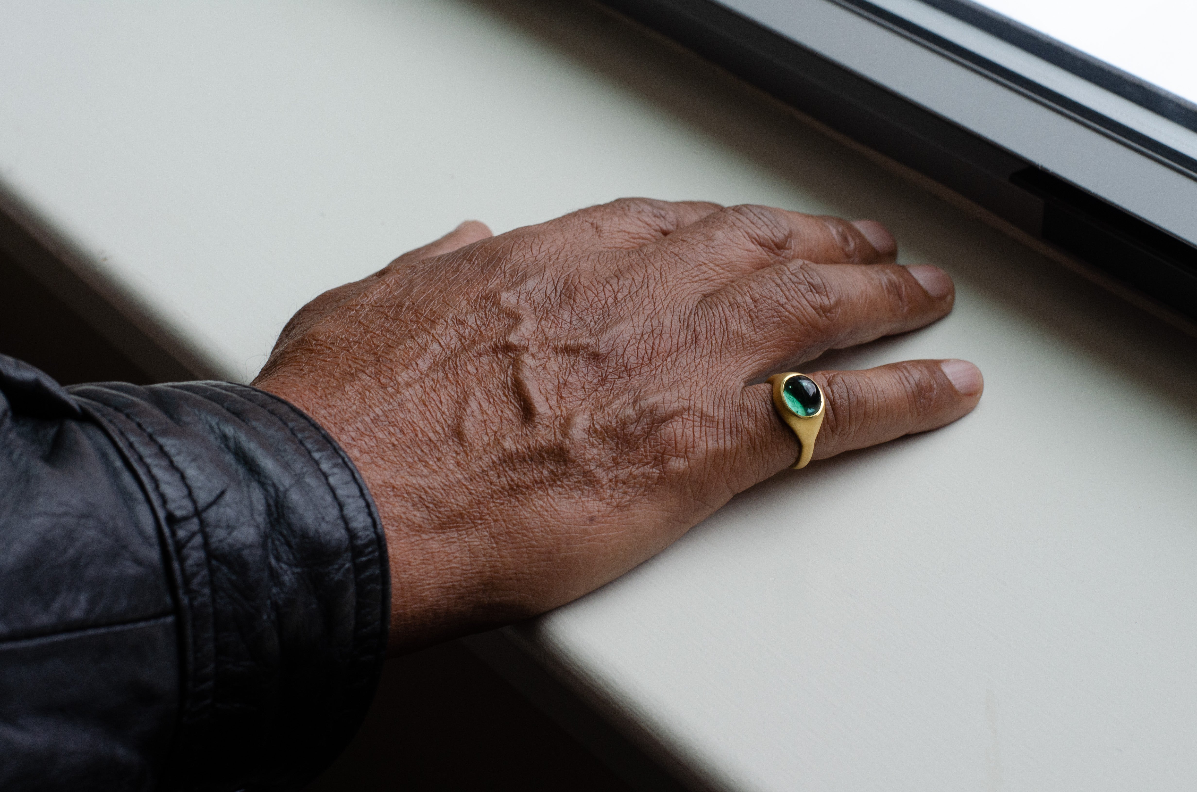 man wearing glace grand indicollite ring pinky ring